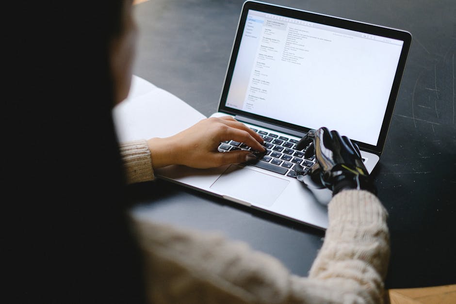 ai robot hand typing keyboard