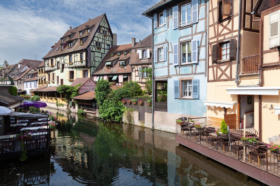alsace village colorful half-timbered houses vineyard