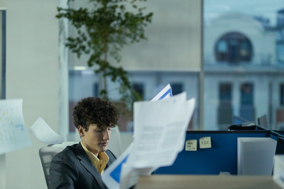 busy professional at desk with blurred background