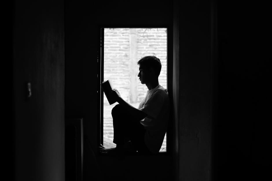 calm person reading book window