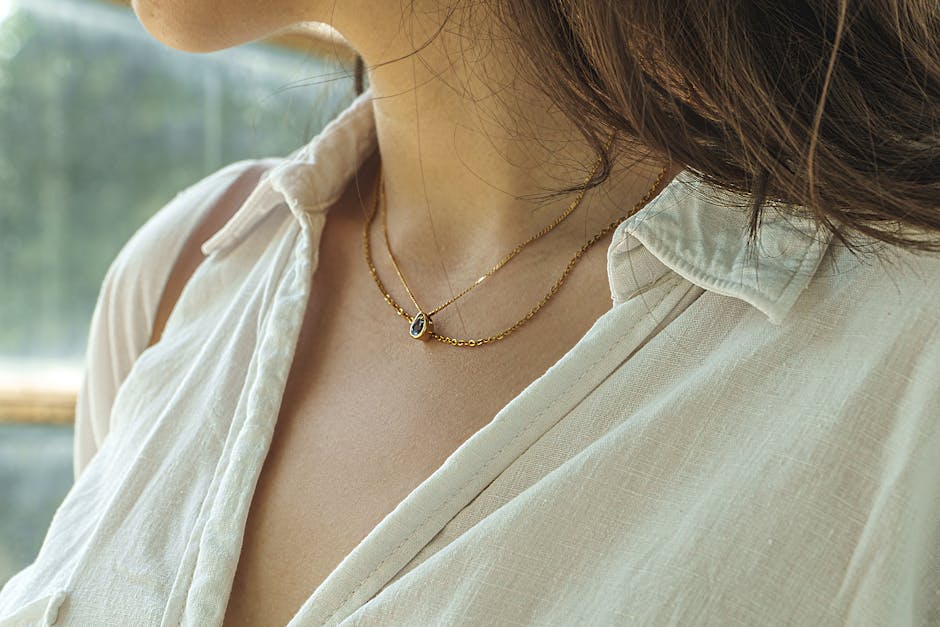 close up woman delicate gold jewelry
