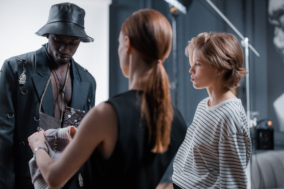 designers backstage preparing models