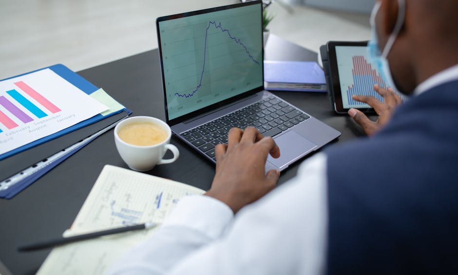 digital entrepreneur working on laptop with AI graphs