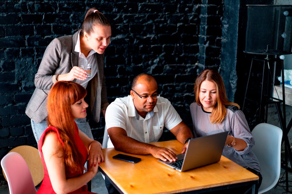 Diverse group collaborating on tech
