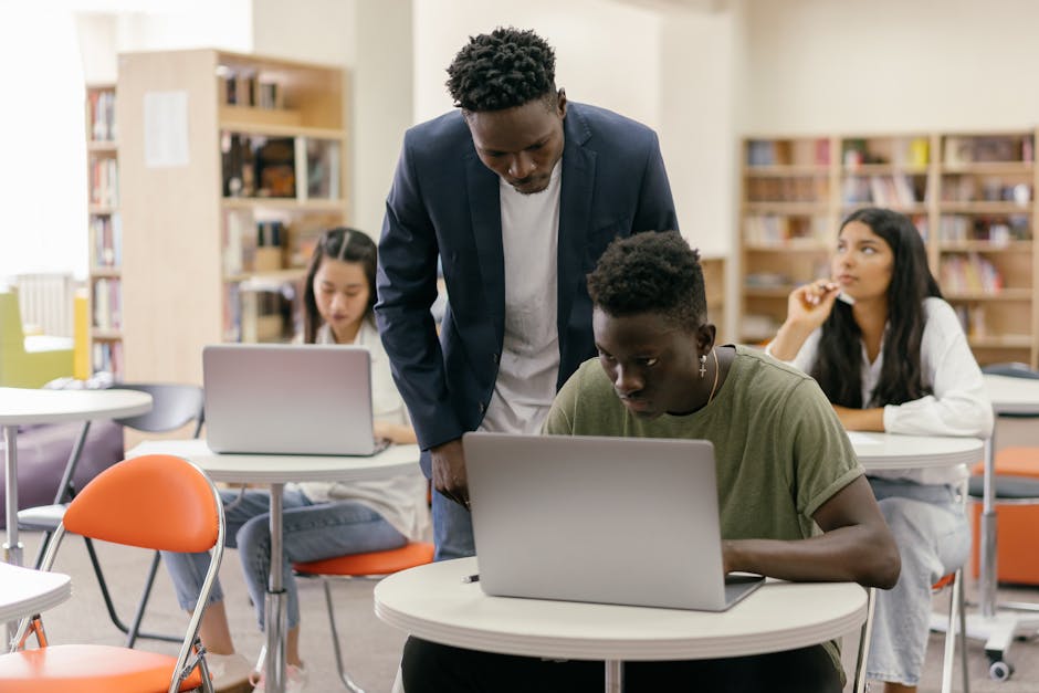 Diverse group of Spanish students learning AI in a classroom