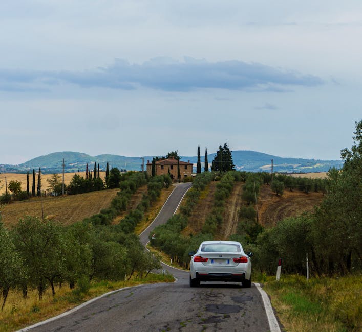 Driving through Tuscany vineyards