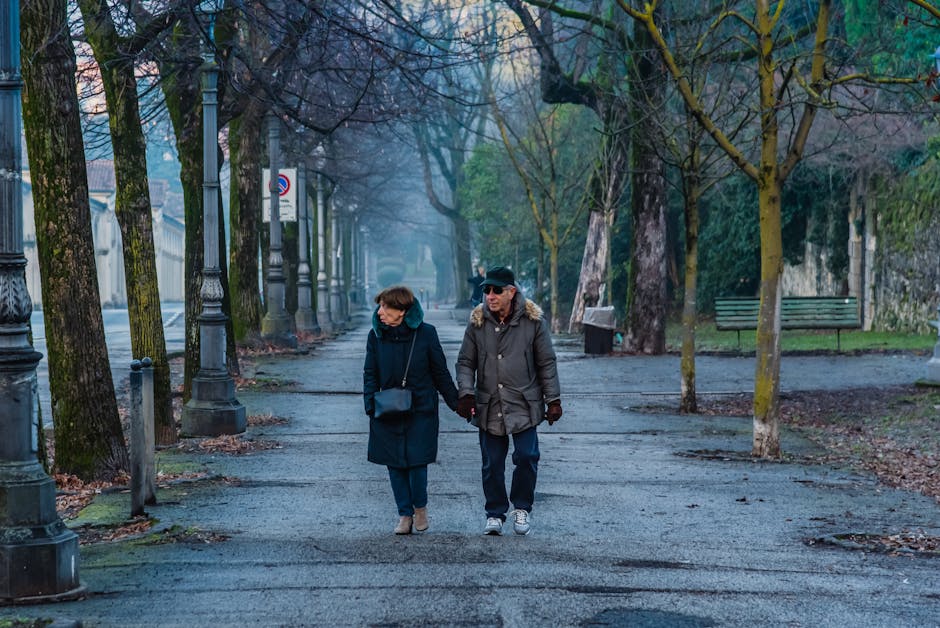 elderly couple walking hand in hand