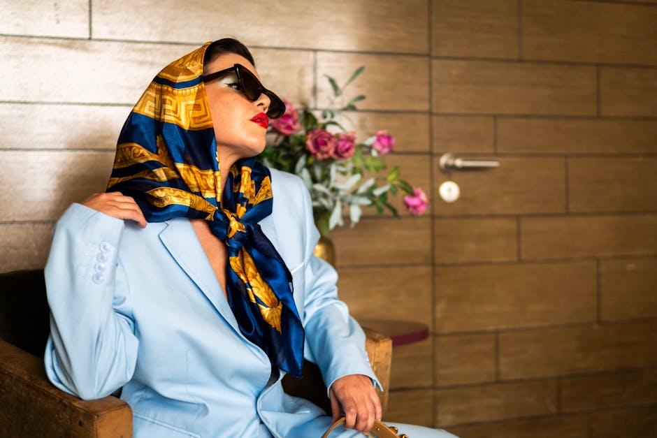 elegant woman accessorizing outfit with scarf