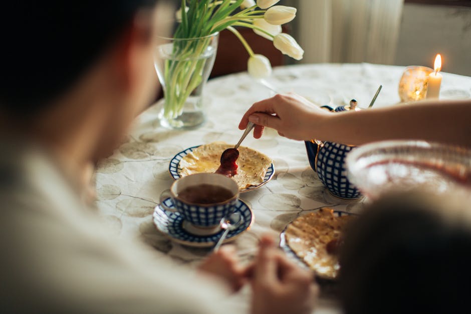 Family eating breakfast traditional Ukrainian home