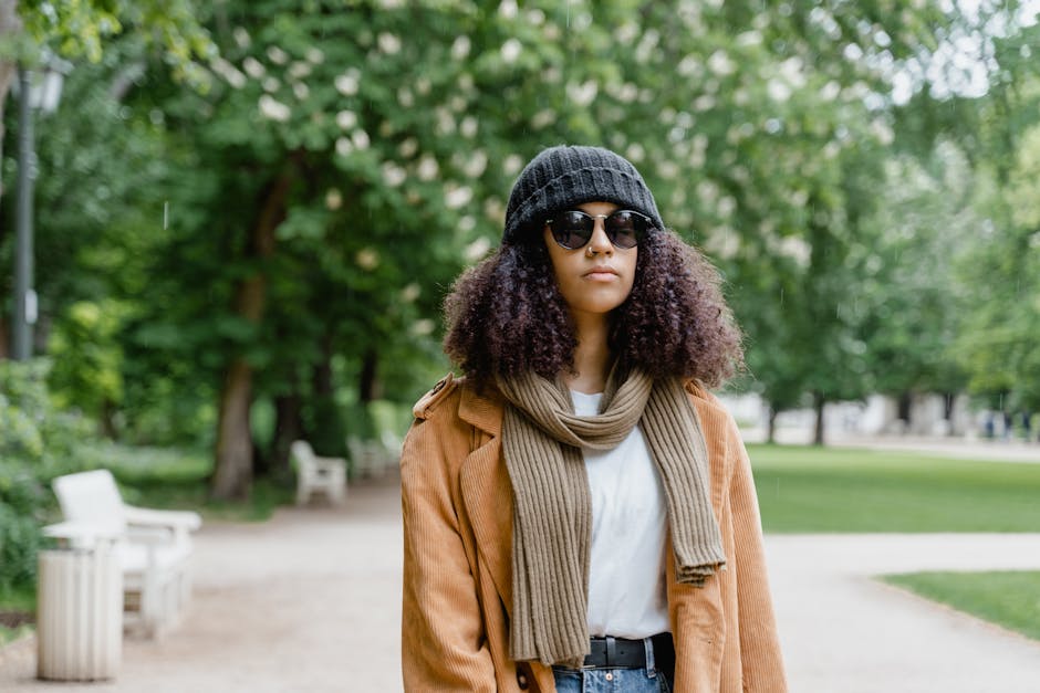 Fashionable woman walking city street with accessories