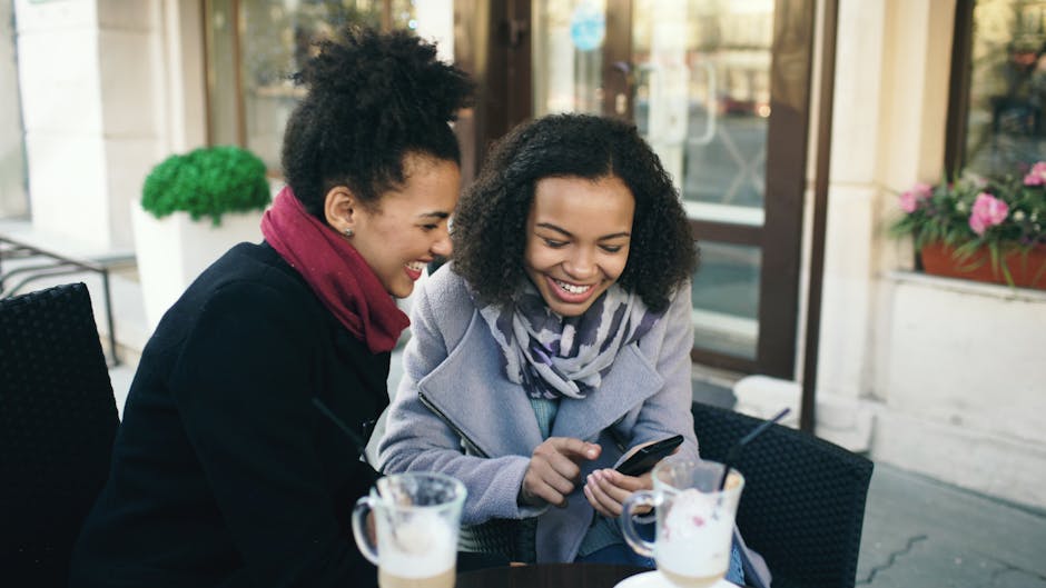 Friends laughing at outdoor cafe