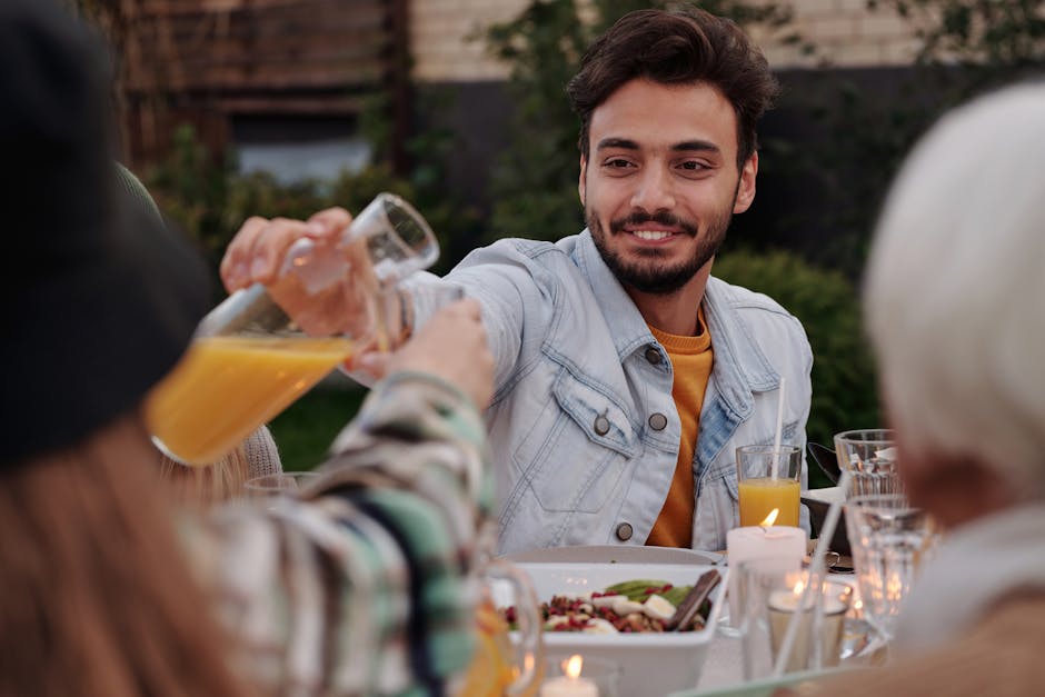 friends laughing enjoying dinner
