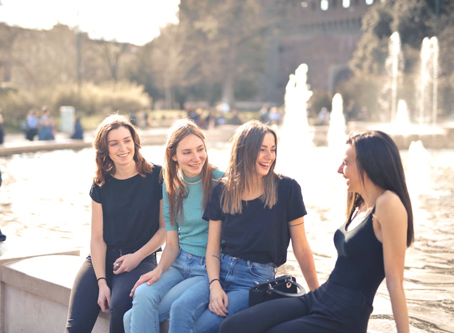 friends laughing in a sunny plaza
