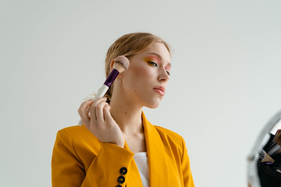 glamorous woman applying makeup