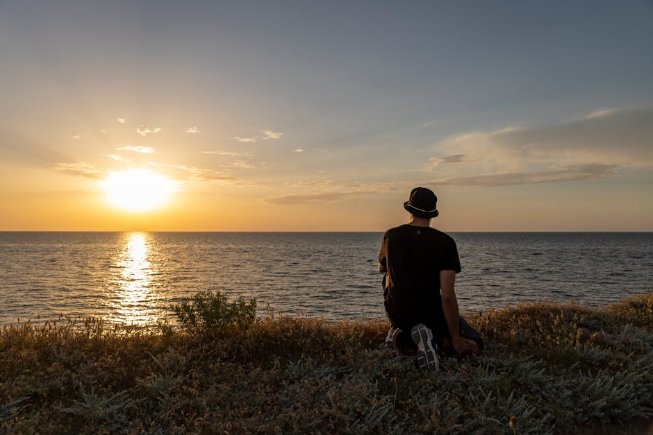 man meditating sunrise
