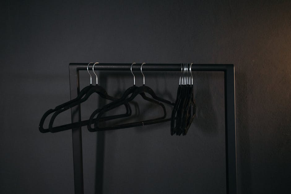 Minimalist wardrobe items on a rail