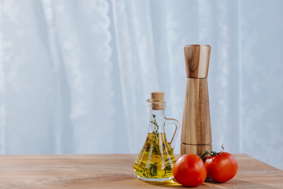 Olive oil bottle and fresh Mediterranean ingredients
