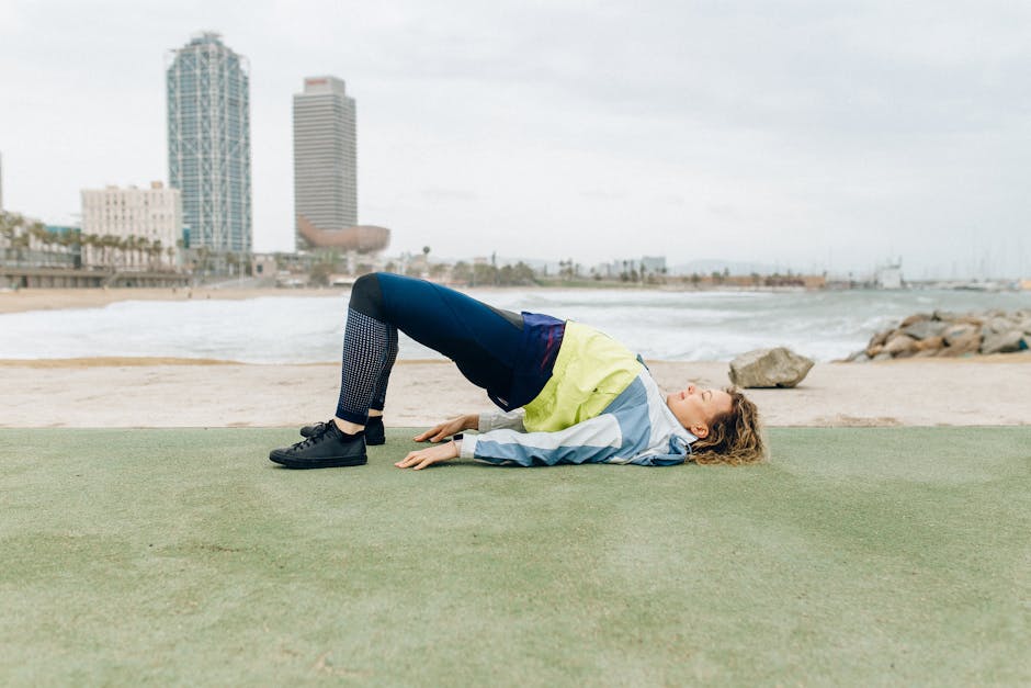 People doing yoga in a park in Barcelona