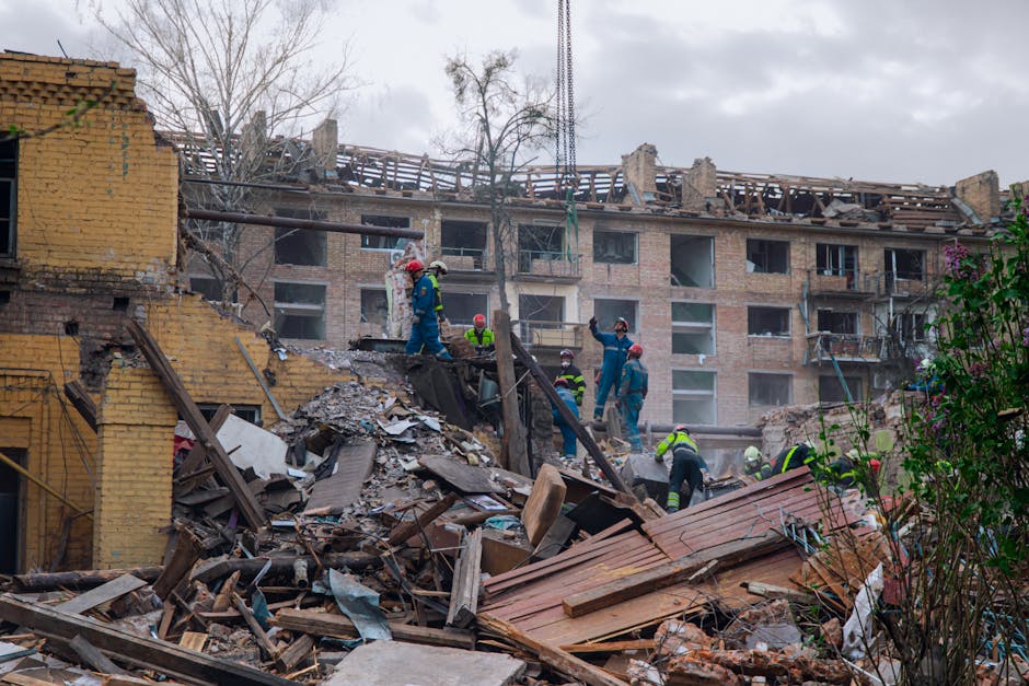 People helping to rebuild destroyed building