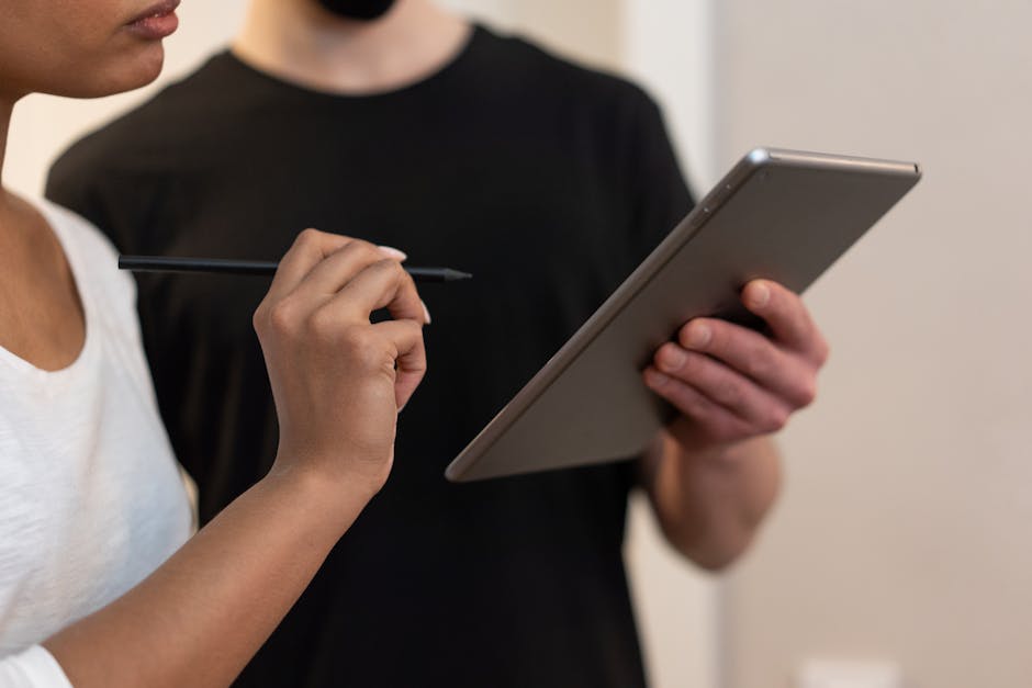 People in discussion about AI on tablet in modern office in Berlin