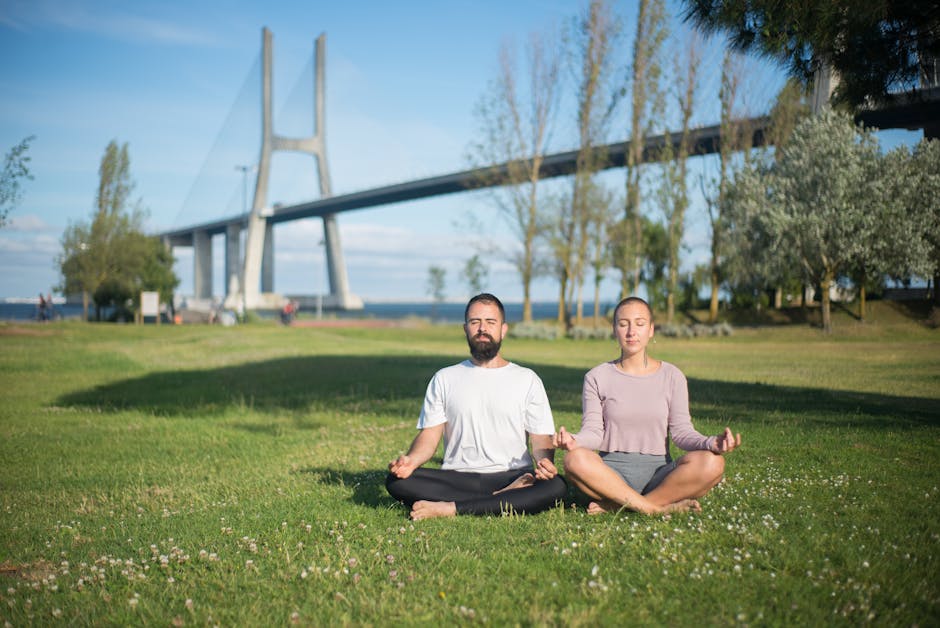 people meditating urban park