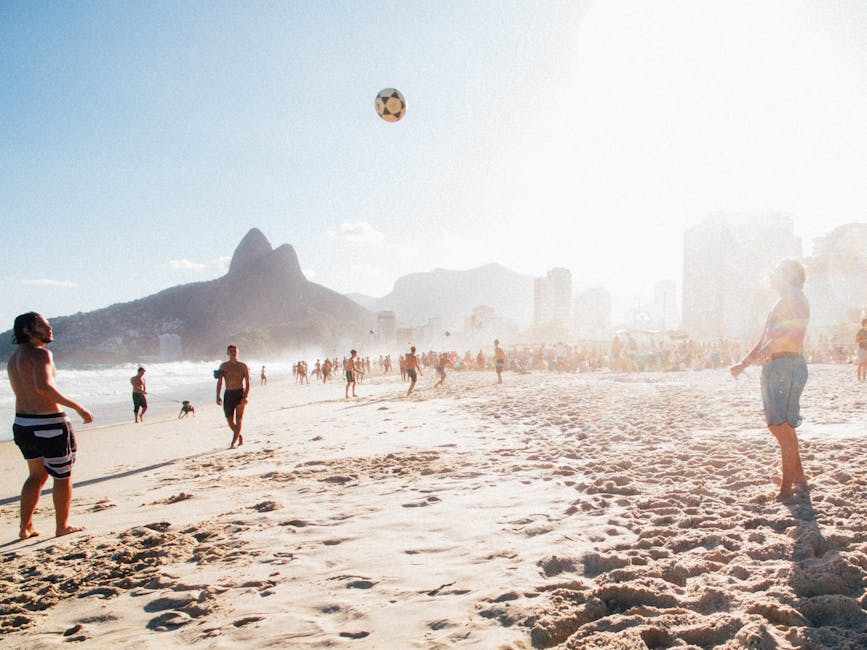 People playing beach volleyball Rio de Janeiro sunset