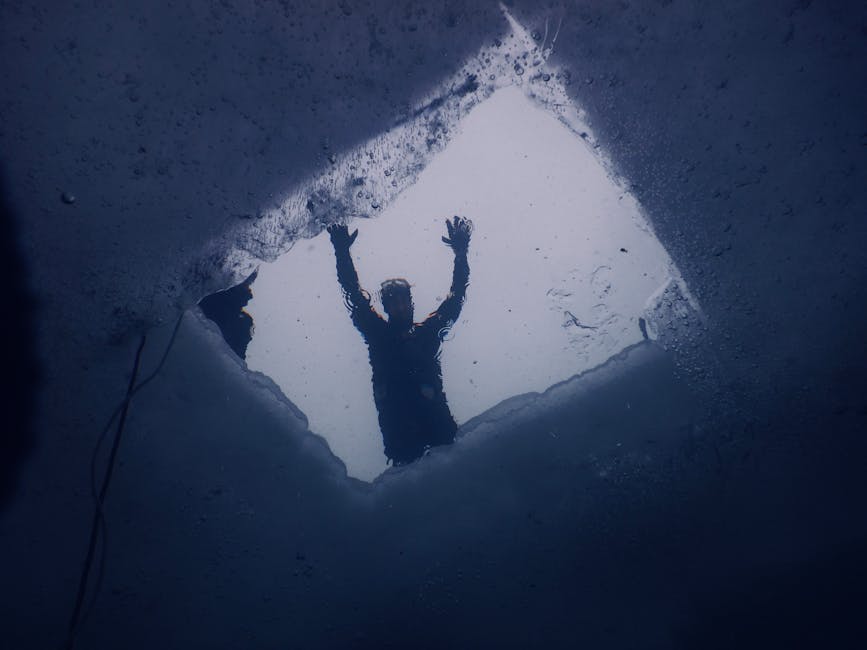 People swimming in ice hole during winter