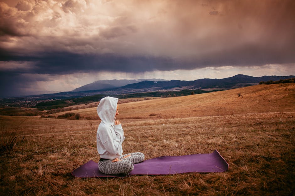 Person meditating in peaceful setting
