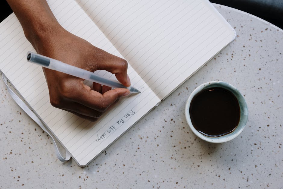 person planning daily schedule coffee
