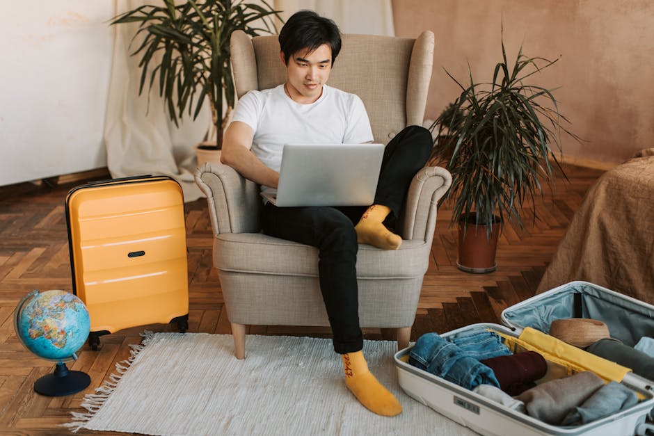 person planning trip on laptop