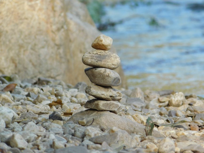 stacking small colorful stones balance