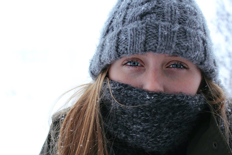 Stylish person bundled in Russian winter accessories, cityscape