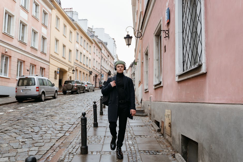 Stylish person in classic outfit walking city street