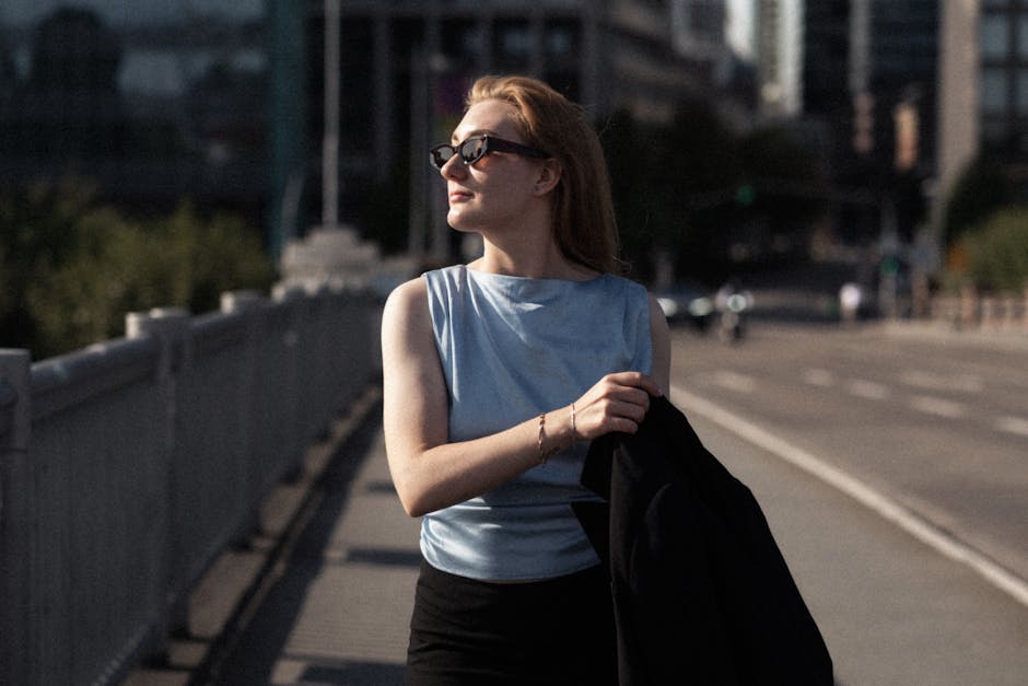 Stylish woman walking confidently in street