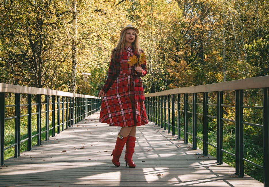 stylish woman walking in fall foliage