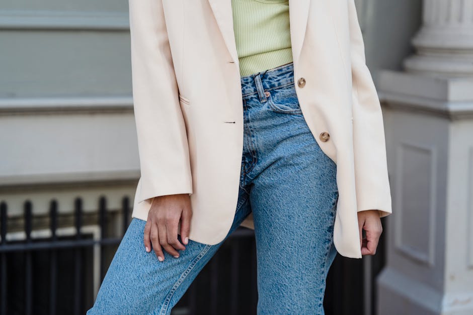 woman changing blazer to denim jacket