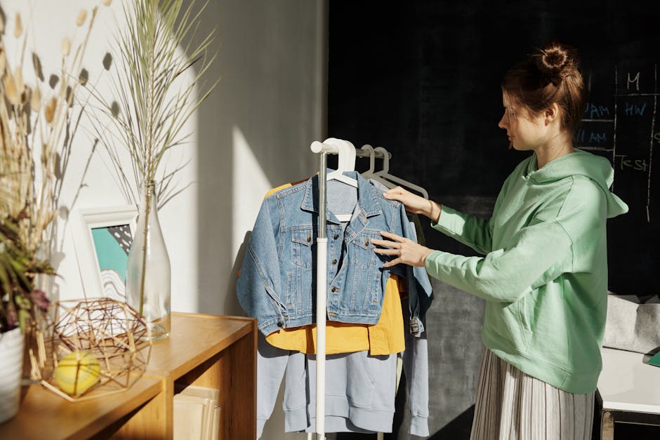 woman choosing clothes from organized wardrobe