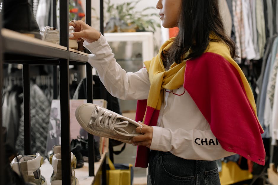 Woman choosing scarf in boutique