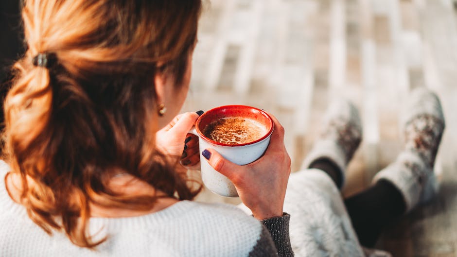 Woman drinking coffee in Polish home