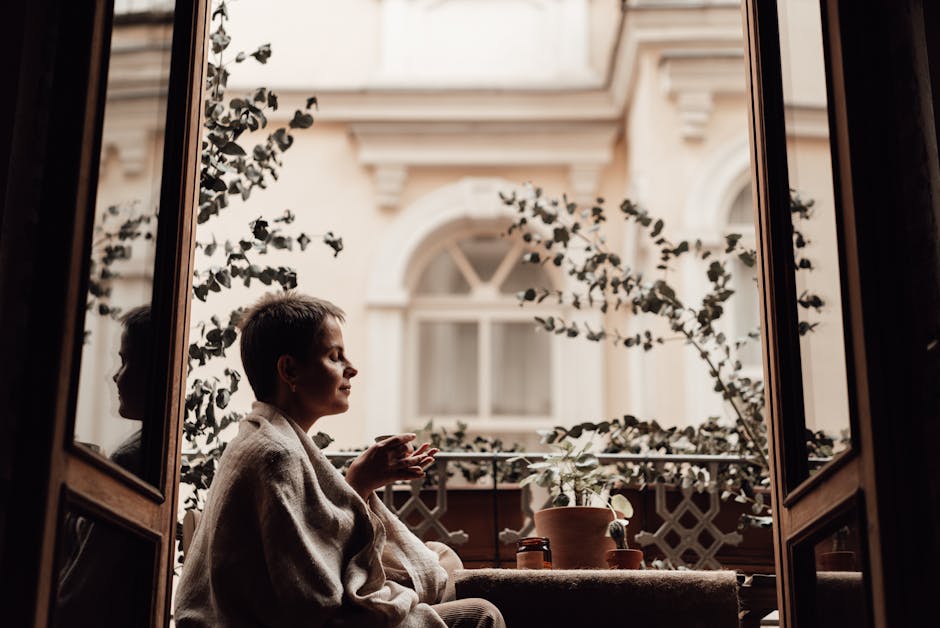 Woman enjoying a relaxing siesta on a balcony