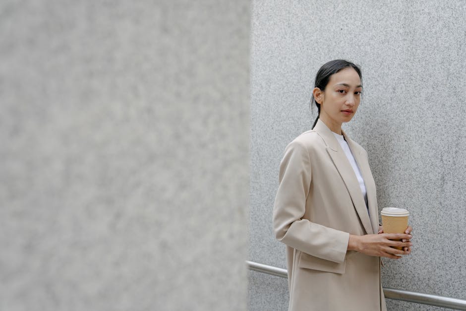 Woman enjoying coffee in a stylish casual outfit