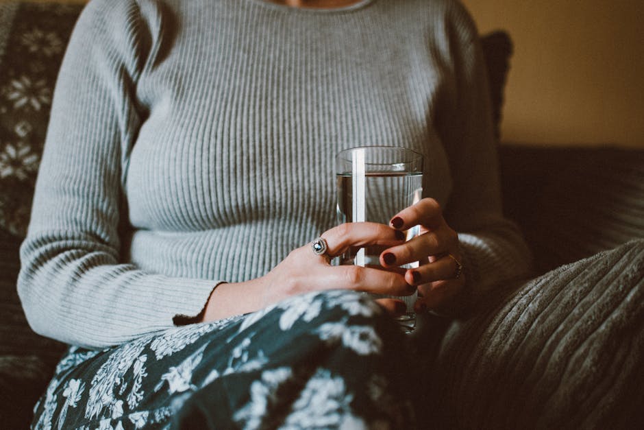 woman enjoying quiet time at home, drinking water