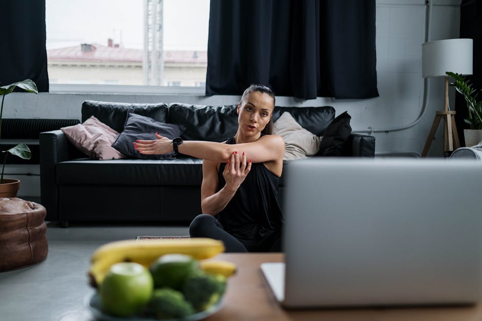 woman exercising living room snowy window