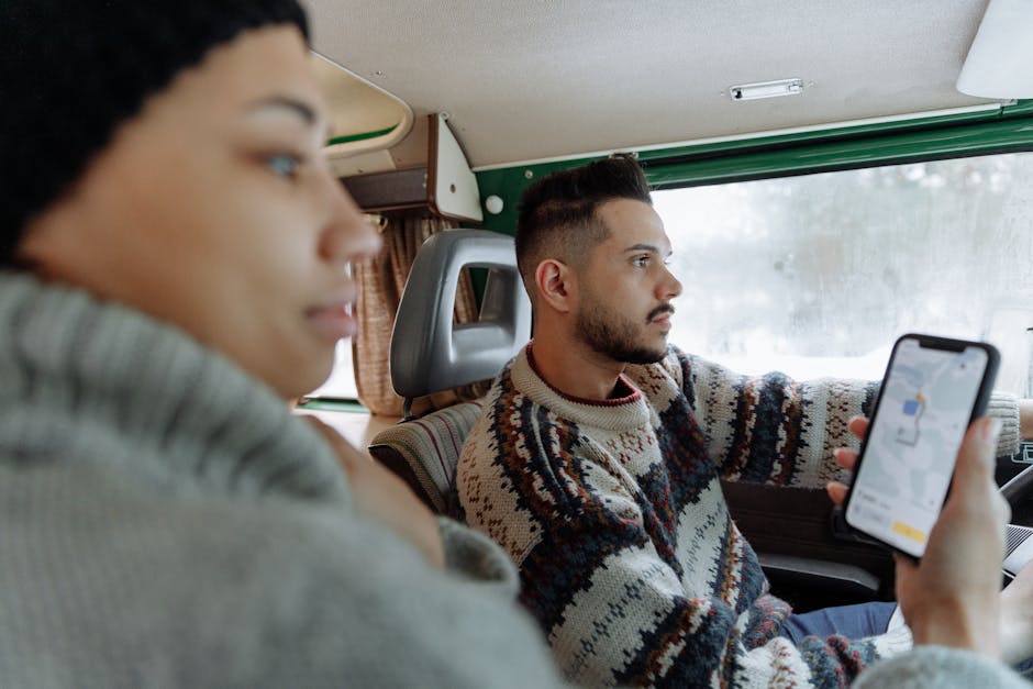 woman looking at map in campervan