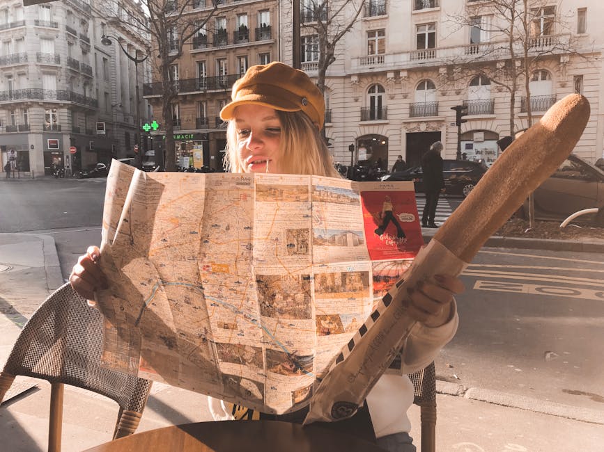 woman looking at map in french village
