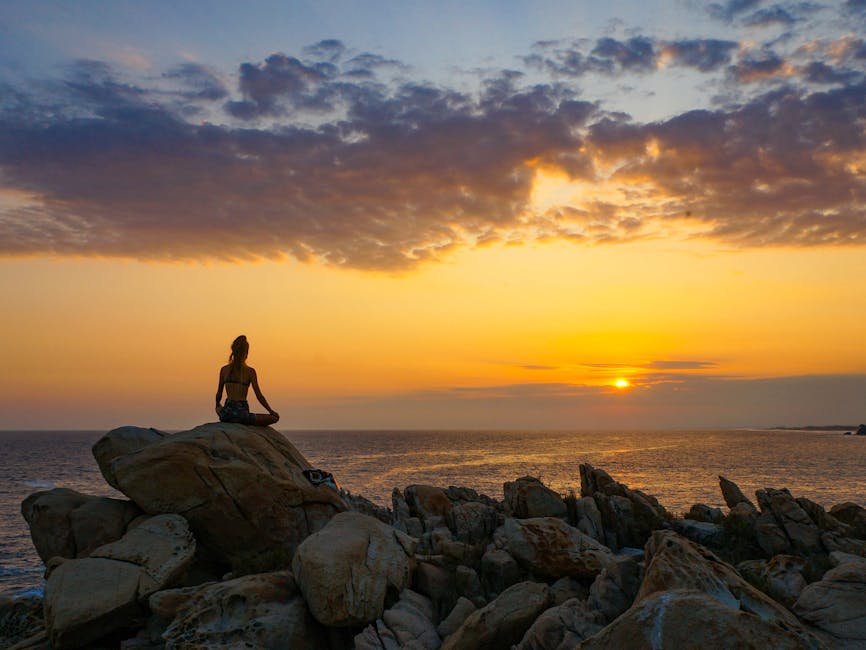 woman meditating calm sunrise