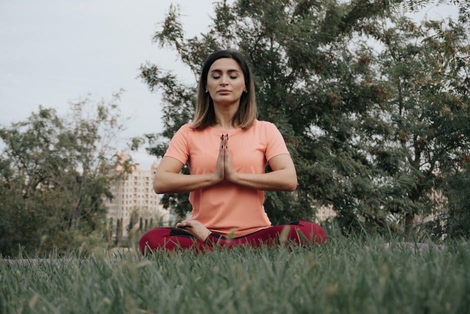 Woman meditating calmly in a park