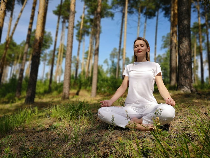 woman meditating in nature russia
