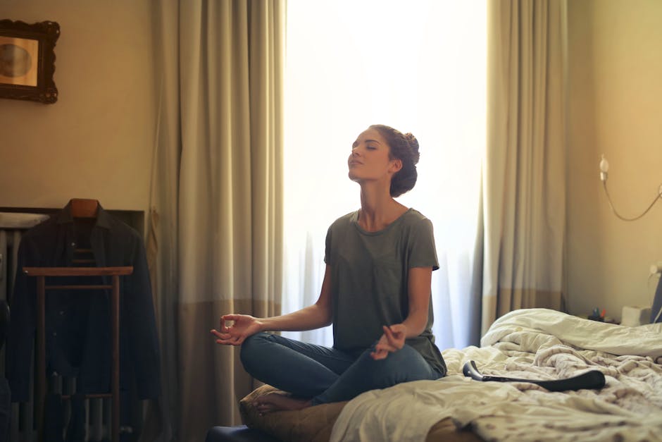 Woman meditating peacefully by a window
