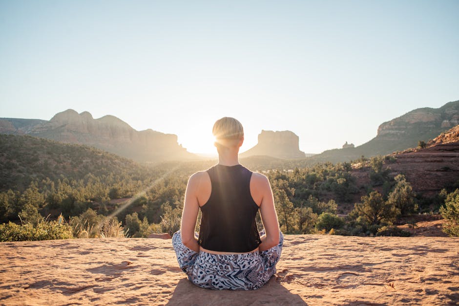 woman meditating with sunrise